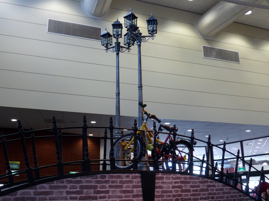 Bridge with street lanterns and bicycles in the Oranje Nassau pavilion at the Keukenhof park