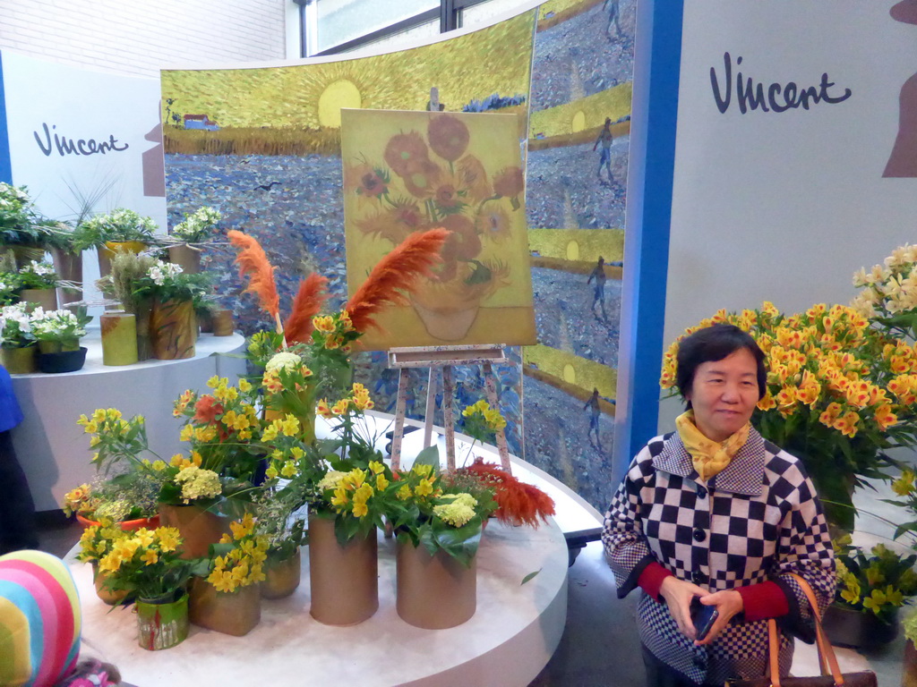 Miaomiao`s mother with flowers at the Vincent van Gogh exhibition in the Oranje Nassau pavilion at the Keukenhof park