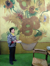 Miaomiao`s mother with a Vincent van Gogh painting in the Oranje Nassau pavilion at the Keukenhof park