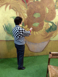 Miaomiao`s mother with a Vincent van Gogh painting in the Oranje Nassau pavilion at the Keukenhof park