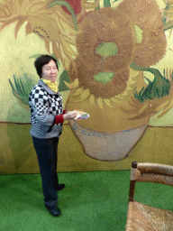 Miaomiao`s mother with a Vincent van Gogh painting in the Oranje Nassau pavilion at the Keukenhof park