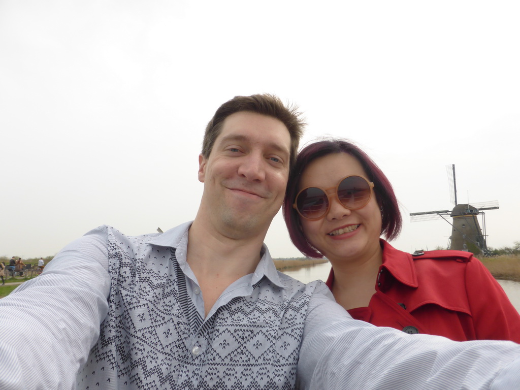 Tim and Miaomiao on the bridge leading to the Museum Windmill Nederwaard, with a view on the Nederwaard No. 3 windmill