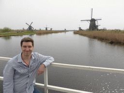 Tim on the bridge leading to the Museum Windmill Nederwaard, with a view on the Nederwaard and Overwaard windmills