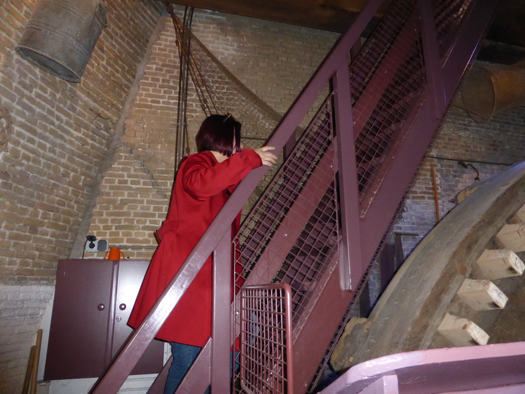 Miaomiao at the staircase from the ground floor to the middle floor of the Museum Windmill Nederwaard