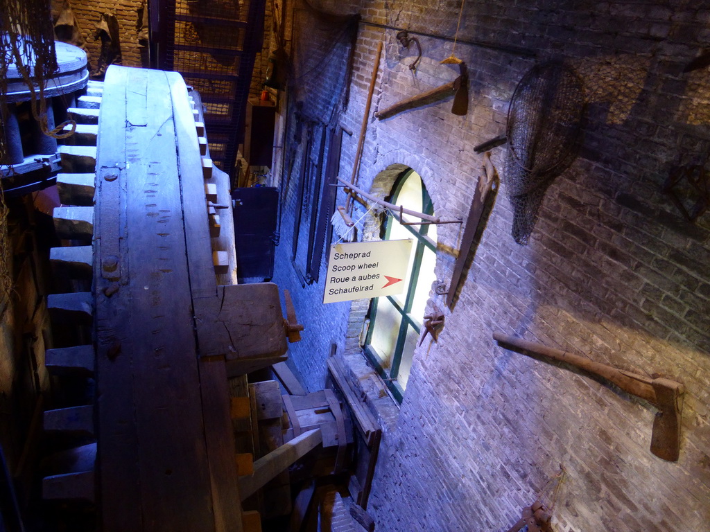 Gear wheels on the ground floor of the Museum Windmill Nederwaard, viewed from the staircase from the under floor