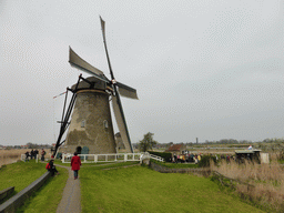 Miaomiao in front of the left side of the Museum Windmill Nederwaard
