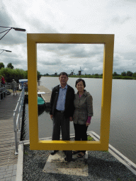 Miaomiao`s parents with a view on the Nederwaard windmills