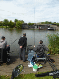 Miaomiao`s father with fishermen at the Molenkade Nederwaard street