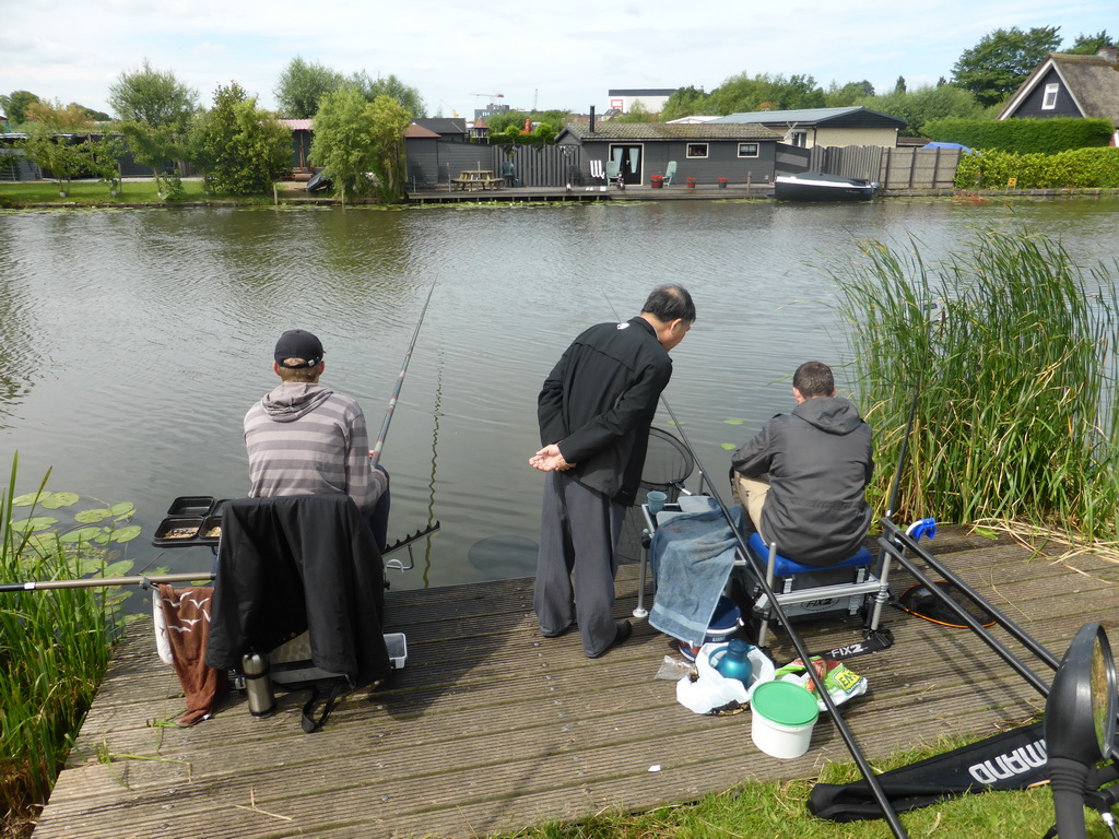 Miaomiao`s father with fishermen at the Molenkade Nederwaard street