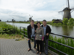 Tim and Miaomiao`s parents with the Nederwaard No. 1 windmill and other Nederwaard windmills