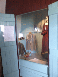 Closet with clothes on the middle floor of the Museum Windmill Nederwaard