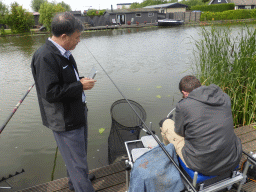 Miaomiao`s father with a fisherman at the Molenkade Nederwaard street