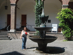 Miaomiao at the Swan Fountain in the Inner Courtyard of the Schwanenburg Castle