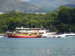 The Elaphiti Islands tour boat and other boats at the Kolocep Harbour, viewed from the Donje Celo Beach