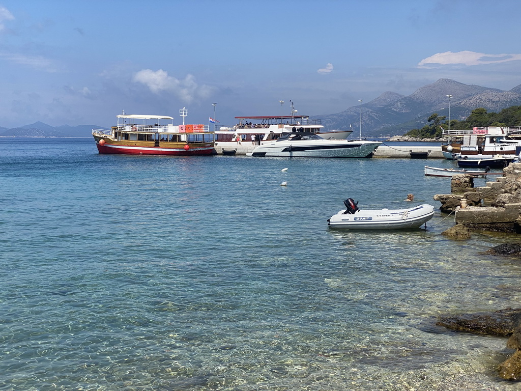 The Elaphiti Islands tour boat and other boats at the Kolocep Harbour, viewed from the Donje Celo street