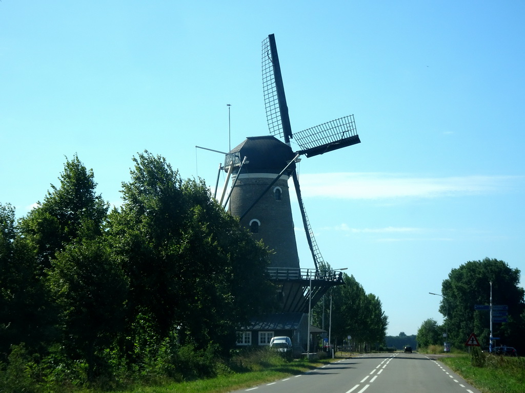 The Korenbloem windmill, viewed from the car on the Molendijk street