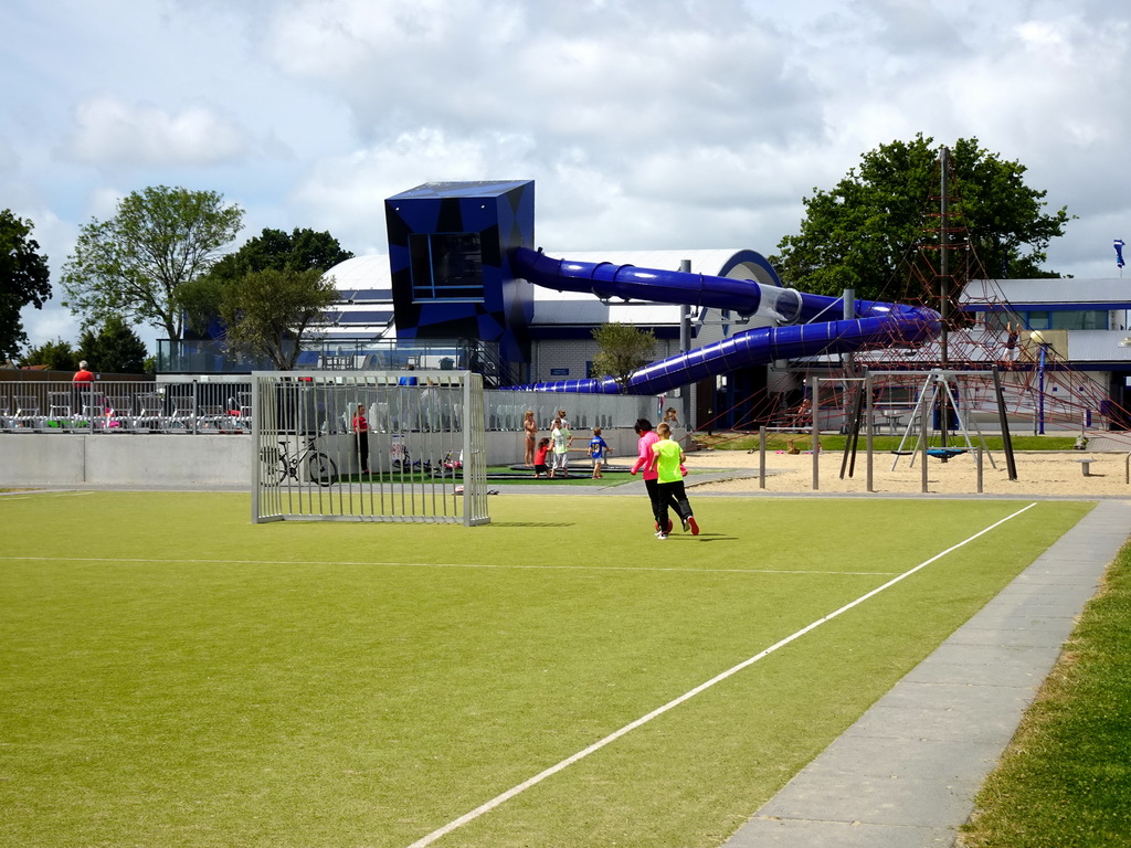 Playground and slide at the outside of the swimming pool at Camping and Villa Park De Paardekreek