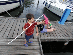 Max and his friend catching crabs on a pier at Camping and Villa Park De Paardekreek
