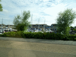 Boats in the Landbouwhaven harbour, viewed from the car on the Havenweg street