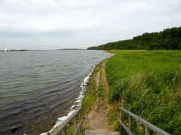 The Veerse Meer lake and a grassland, viewed from a bridge at Camping and Villa Park De Paardekreek