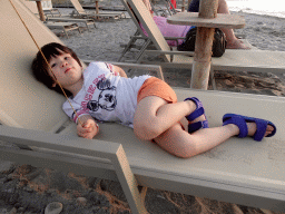 Max on a sun lounger on the beach of the Blue Lagoon Resort, at sunset