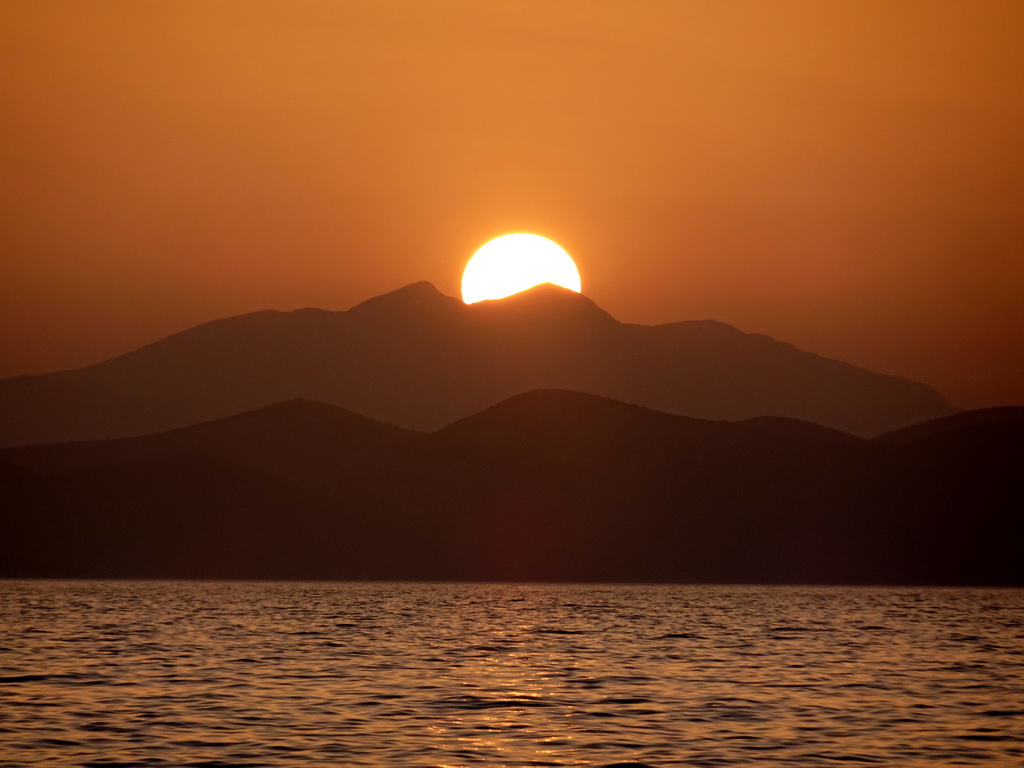 The Aegean Sea and the Bodrum Peninsula in Turkey, viewed from the beach of the Blue Lagoon Resort, at sunset