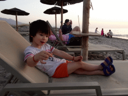 Max on a sun lounger on the beach of the Blue Lagoon Resort, at sunset