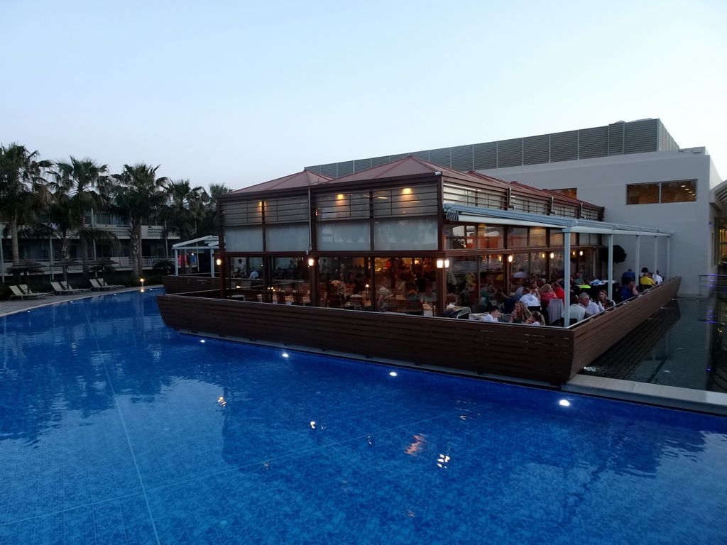 The Main Pool and the Nisos Restaurant at the Blue Lagoon Resort, at sunset