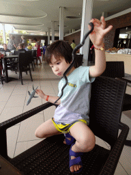 Max playing with animal toys at the Mesogios Pool Restaurant at the Blue Lagoon Resort