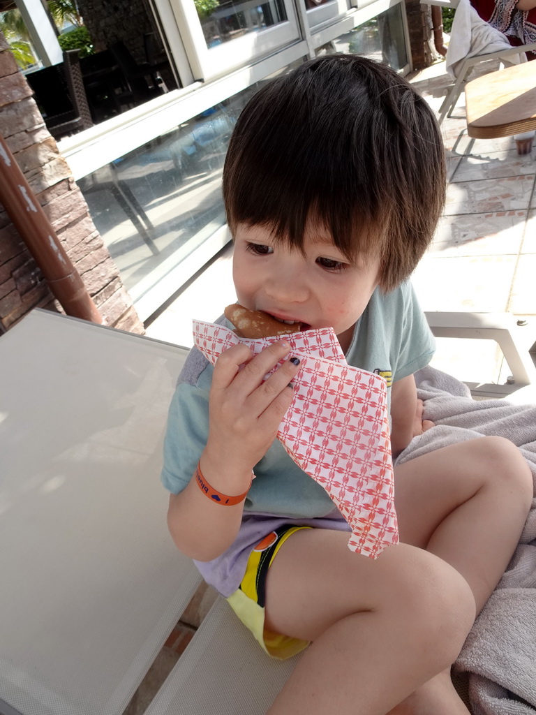 Max eating a pancake at the Main Pool at the Blue Lagoon Resort