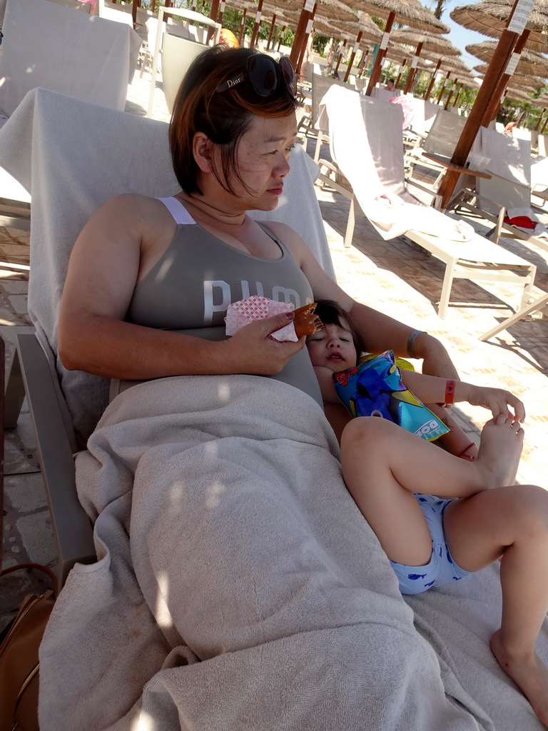 Miaomiao and Max eating a pancake at the Main Pool at the Blue Lagoon Resort