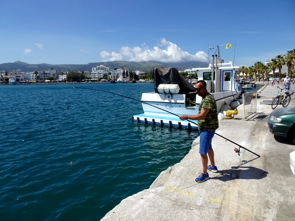 Fishermen and boat at the northwest side of the Limenas Ko harbour