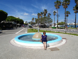 Miaomiao at a fountain at the Akti Kountouriotou street