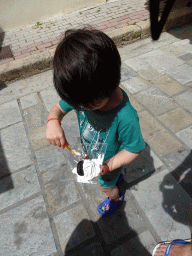 Max with an ice cream at the Antinavarchou Ippokratous Ioannidi street