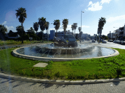 Fountain at the roundabout on the east end of the Asklipioy street, viewed from the tour bus