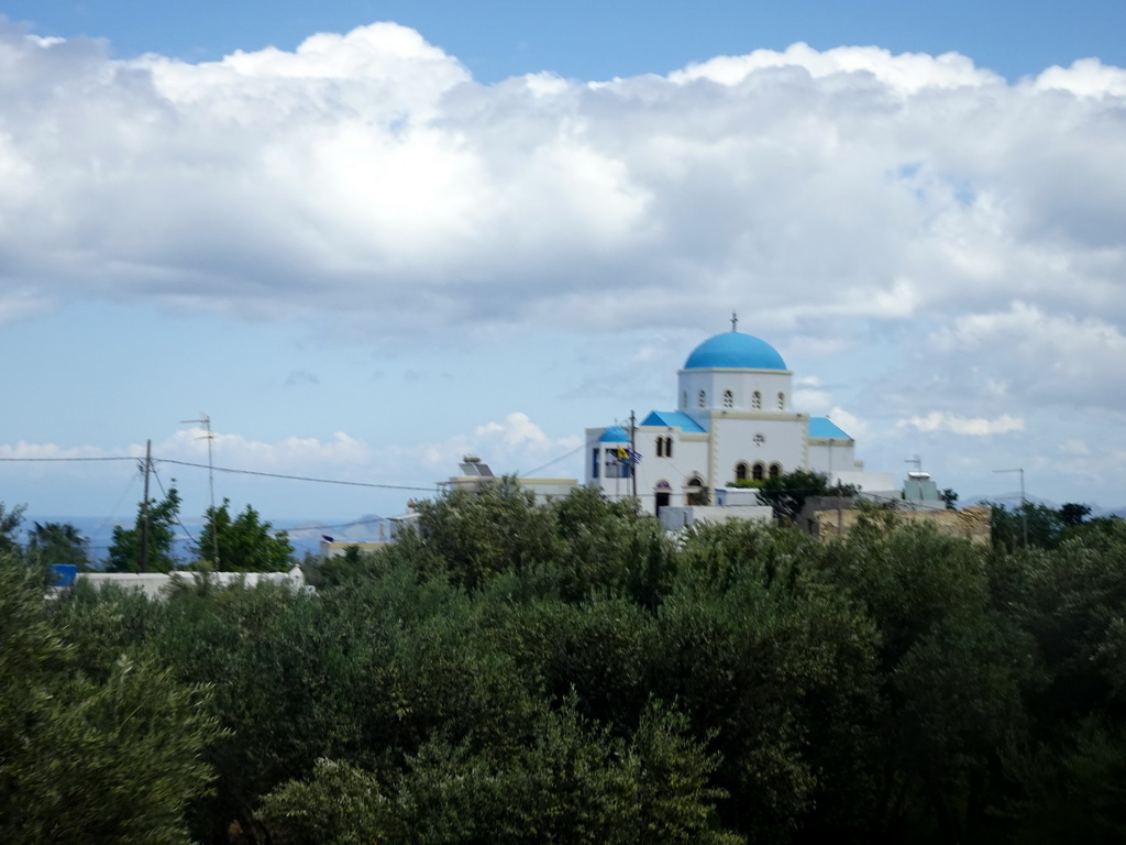 The Holy Church of the Birth of the Virgin Mary at the north side of the town of Zia, viewed from the tour bus on the Miniera Asfendiou street