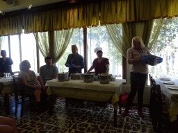 Tour guides showing the ingredients of Moussaka at the Taverna Olympia restaurant at the town of Zia