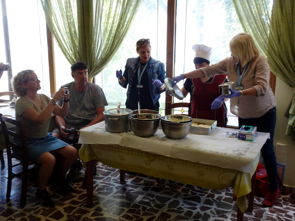 Tour guides showing the ingredients of Moussaka at the Taverna Olympia restaurant at the town of Zia