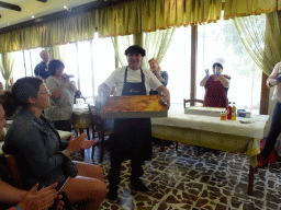 Cook showing the Moussaka at the Taverna Olympia restaurant at the town of Zia