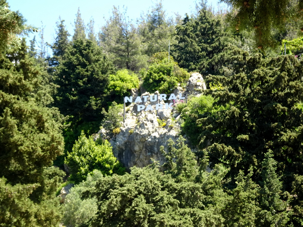 The letters `National Park` on the slope of Mount Dikeos, viewed from the town of Zia