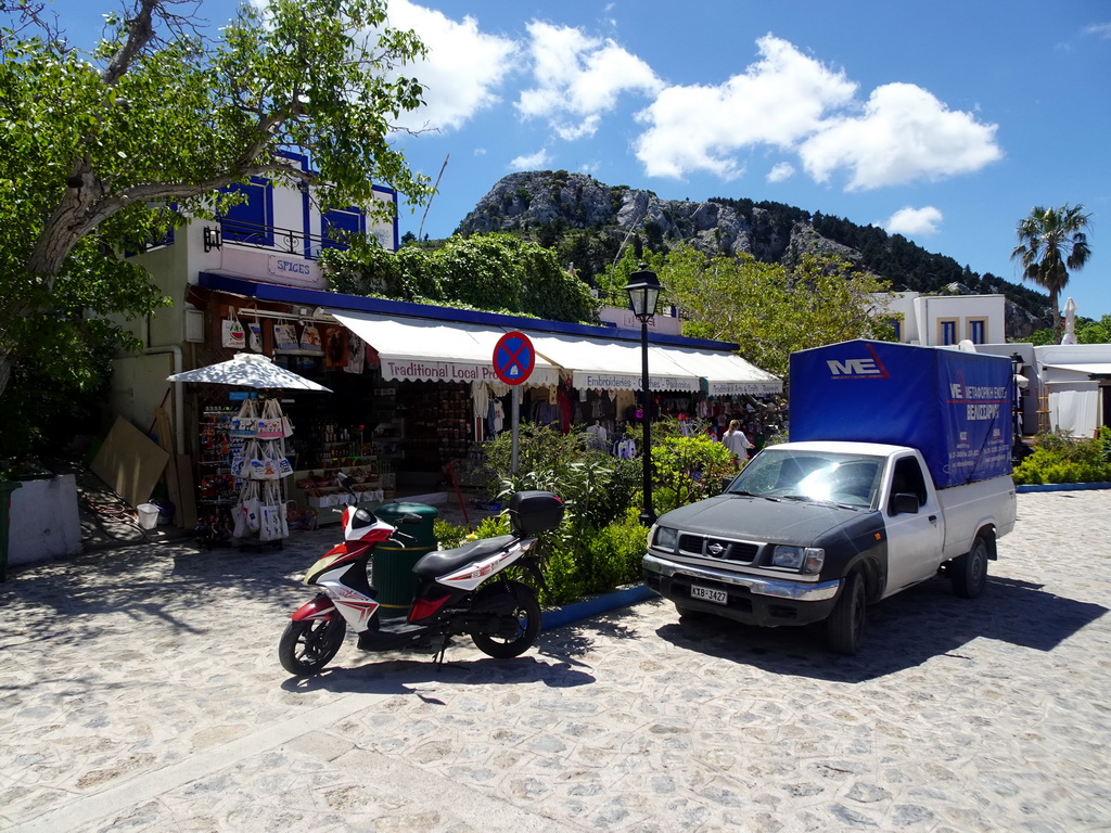 Souvenir shops at the main street of the town of Zia, and Mount Dikeos