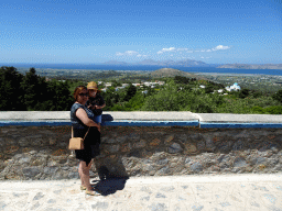 Miaomiao and Max at the viewing point at the north side of the town of Zia, with a view on the Holy Church of the Birth of the Virgin Mary, the north side of the island, the Aegean Sea and the islands of Kalymnos and Pserimos