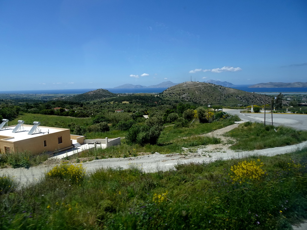 The north side of the island, the Aegean Sea and the islands of Kalymnos and Pserimos, viewed from the tour bus on the Miniera Asfendiou street