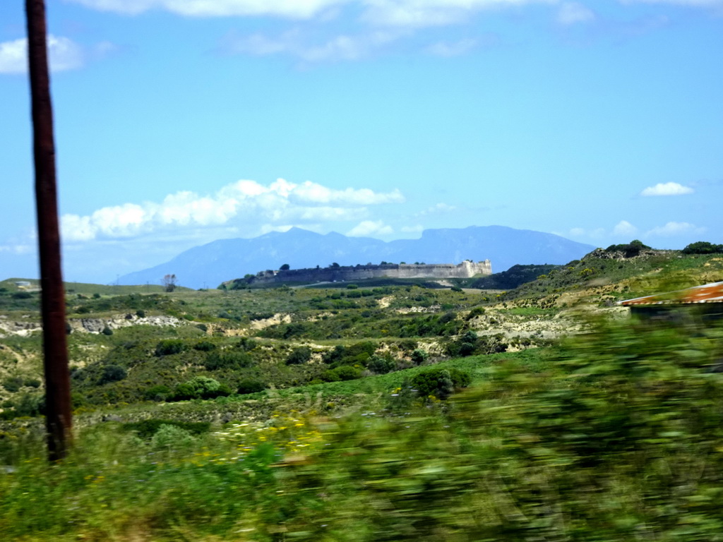 Antimachia Castle and Mount Dikeos, viewed from the tour bus on the Eparchiakis Odou Ko-Kefalou street at the town of Antimachia