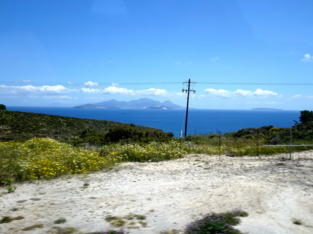 The southwest side of the island, the Aegean Sea and the islands of Giali, Nisiros, Pergoussa Nisyrou and Pachia, viewed from the tour bus on the Eparchiakis Odou Ko-Kefalou street