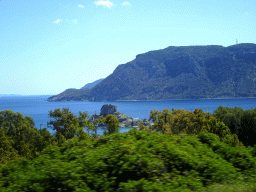 The island of Palaiokastro and the mountains on the southwest end of the island, viewed from the tour bus on the Eparchiakis Odou Ko-Kefalou street