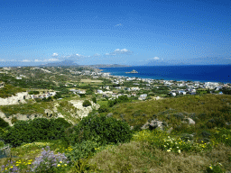 The town of Kefalos, the Aegean Sea, the island of Palaiokastro and Mount Dikeos, viewed from the tour bus