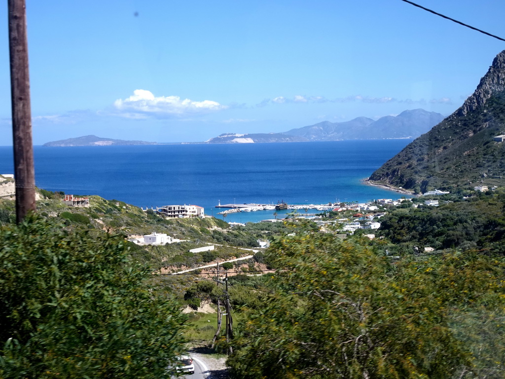 The town of Kamari, the Aegean Sea and the islands of Giali and Nisiros, viewed from the tour bus on the Eparchiakis Odou Ko-Kefalou street at the town of Kefalos