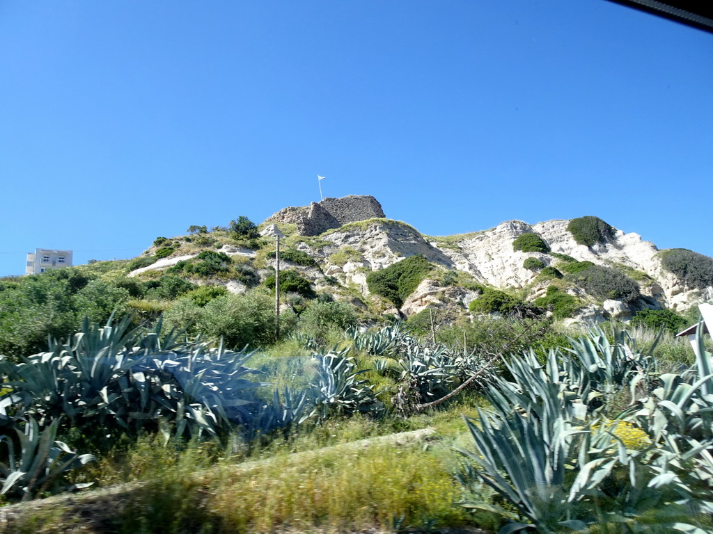 Ruins of the Kefalos Castle, viewed from the tour bus on the Eparchiakis Odou Ko-Kefalou street