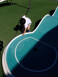 Max playing minigolf at the Minigolf Court at the Blue Lagoon Resort